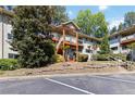 Apartment building exterior showcasing a two-story design, private balconies, and ample parking at 3046 Briarcliff Ne Rd # 7, Atlanta, GA 30329