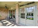 Charming front porch with stylish doors and space for seating, perfect for relaxing at 9075 Preston Ln, Suwanee, GA 30024