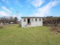 A grassy backyard with a home in the background at 1683 Candler Rd, Decatur, GA 30032