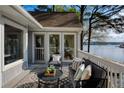 Inviting outdoor deck with cozy seating and stunning waterfront views, perfect for relaxing and entertaining at 3711 Spinnaker Cir, Alpharetta, GA 30005