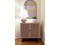 A foyer table with a lamp and decorative accents for a welcoming entryway at 3711 Spinnaker Cir, Alpharetta, GA 30005