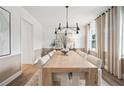 Bright dining room features a stylish table, and neutral tones at 1636 Tide Mill Rd, Cumming, GA 30040