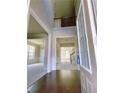 Bright, two-story foyer showcasing hardwood floors and views into adjacent rooms at 556 Paden Ridge Way, Lawrenceville, GA 30044