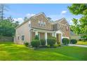 Beautiful two-story home with manicured landscaping and partial side view at 6533 Waterford Sw St, Atlanta, GA 30331