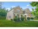 Beautiful two-story home with manicured landscaping and partial side view at 6533 Waterford Sw St, Atlanta, GA 30331