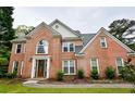 Beautiful brick house with detailed architecture and a well-maintained lawn, offering a glimpse of suburban living at 2238 Roseberry Ln, Grayson, GA 30017