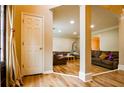 Inviting living space featuring hardwood floors, a cozy seating arrangement, and a view into adjacent rooms at 2238 Roseberry Ln, Grayson, GA 30017