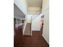 Inviting foyer with hardwood floors, staircase, and high ceilings, creating an airy and open entrance at 3967 Moos Creek Ct, Loganville, GA 30052