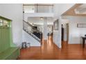 Elegant foyer with hardwood floors, staircase, and open view to other rooms, offering a grand entrance at 415 Eldridge Dr, Suwanee, GA 30024