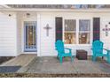 Inviting front porch with cozy seating, perfect for enjoying the outdoors at 4247 Windward Ln, Norcross, GA 30093