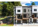 Contemporary townhome exterior featuring private balconies and landscaped front yard at 2328 Mason Drive Dr, Atlanta, GA 30316