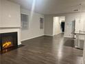 Spacious living room featuring wood flooring, a fireplace and natural light at 6615 Bluffview Dr, Douglasville, GA 30134