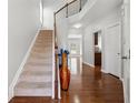 Bright foyer featuring hardwood floors, staircase, and tall ceilings at 6270 Shiloh Woods Dr, Cumming, GA 30040