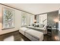 Bright living room with dark hardwood floors, neutral furnishings, and ample natural light at 7155 Roswell Rd # 15, Atlanta, GA 30328