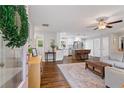 Inviting living room featuring hardwood floors, neutral walls, and updated fixtures at 5725 Brenda Sw Dr, Mableton, GA 30126