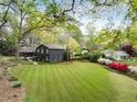 Expansive backyard with lush lawn and landscaping surrounding this stunning single Gathering home at 259 Dartmoor Cir, Atlanta, GA 30328