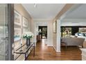 Inviting foyer showcasing hardwood floors, elegant decor, and seamless flow into the living spaces at 259 Dartmoor Cir, Atlanta, GA 30328