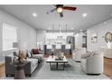 Stylishly staged living area with open floor plan flowing into a modern kitchen with a spacious island at 515 Federal Se Ter, Atlanta, GA 30315