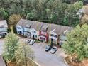 Aerial shot of townhouses surrounded by mature trees, showcasing the community layout at 1797 Brookside Lay Cir, Norcross, GA 30093