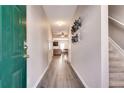Open entryway with hardwood floors and a view into the living and dining areas at 2968 Greyhawk Ln, Cumming, GA 30040