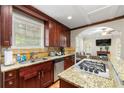 Stylish kitchen with granite countertops, stainless steel appliances, and a gas stovetop at 1326 Mcpherson Ave., Atlanta, GA 30316