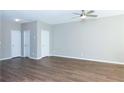 Spacious bedroom features wood floors, neutral walls, ceiling fan, and two closets at 2384 Coach Way, Jonesboro, GA 30236