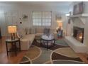 Cozy living room with a fireplace, comfortable seating, and stylish decor at 4148 Silver Hill Ct, Snellville, GA 30039