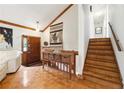 Elegant foyer with high ceilings, wooden accents, decorative console table, and staircase at 3730 Willow Mill Dr, Lawrenceville, GA 30044