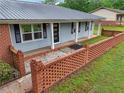 View of a lovely single-story home with a brick facade and well-manicured landscaping at 815 Tanner Rd, Dacula, GA 30019
