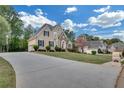 Inviting home with a long driveway and well-maintained lawn at 1405 Wilmington Way, Grayson, GA 30017