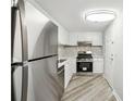 Bright kitchen features stainless steel appliances, white cabinets, and a stylish tile backsplash at 1501 Clairmont Rd # 1624, Decatur, GA 30033