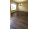 Open living area featuring ample natural light and modern chandelier at 237 Summergate Ln, Villa Rica, GA 30180