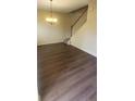 Open living area featuring new flooring, staircase and modern chandelier at 237 Summergate Ln, Villa Rica, GA 30180