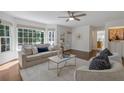 Bright living room features large windows, neutral decor, and hardwood floors at 4366 Karls Gate Dr, Marietta, GA 30068