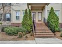 Inviting front entrance with brick stairs and lush landscaping at 1668 Sabastian Ne Pt, Atlanta, GA 30329
