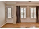 Bright living room featuring hardwood floors, modern windows, and elegant trim at 1668 Sabastian Ne Pt, Atlanta, GA 30329