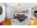 Cozy living room with hardwood floors, comfortable seating, and stylish decor, creating a relaxing atmosphere at 4620 Westgate Dr, Cumming, GA 30040