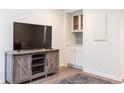 Living room showcasing entertainment center with a large TV and built in display at 1101 Collier Nw Rd # U2, Atlanta, GA 30318