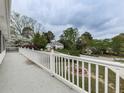 Long balcony showing other homes in the neighborhood and a white railing at 1606 Nuthatch Ct, Marietta, GA 30062