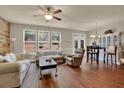 Open living room area with hardwood floors and access to outdoor space at 587 Jody Pl, Lilburn, GA 30047