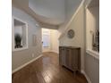 Inviting entryway featuring hardwood floors, neutral paint, and built-in display shelves at 2692 Briaroak Dr, Duluth, GA 30096
