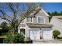 Charming two-story home featuring a two-car garage and landscaped front yard at 2692 Briaroak Dr, Duluth, GA 30096