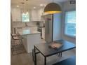 Bright kitchen with stainless steel appliances, granite countertops, and a large island at 609 Spring St, Atlanta, GA 30354