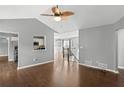 Open living room featuring hardwood floors, recessed lights, and a view into the kitchen at 6332 Fairoaks Pl, Douglasville, GA 30135