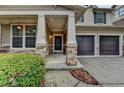Charming front porch with stone accents and a well-manicured lawn at 13030 Dartmore Ave, Alpharetta, GA 30005