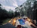 Scenic aerial view of backyard pool with lush landscaping at 1886 Chedworth Ct, Stone Mountain, GA 30087