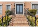 Close-up of the front entrance with a brick steps, double doors and metal railings at 11570 Dunhill Place Dr, Johns Creek, GA 30005