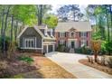Beautiful two-story home with brick and siding exterior, showcasing a well-maintained lawn and inviting curb appeal at 201 Rippling Nw Dr, Marietta, GA 30064