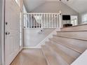 Bright entryway featuring light wood floors, staircase, and a vaulted ceiling for a grand welcome at 6040 Carriage Dr, Cumming, GA 30028