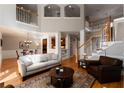 Spacious living room with high ceilings and elegant staircase at 12120 Dancliff Trce, Alpharetta, GA 30009